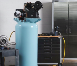 Professional using air compressor in workshop